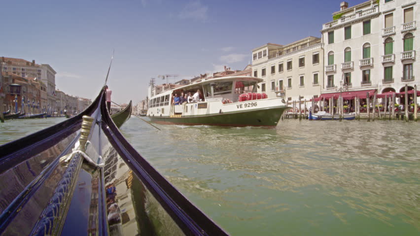 VENICE, ITALY - MAY 2, 2012: Tour boat on the Grand Canal from a gondola