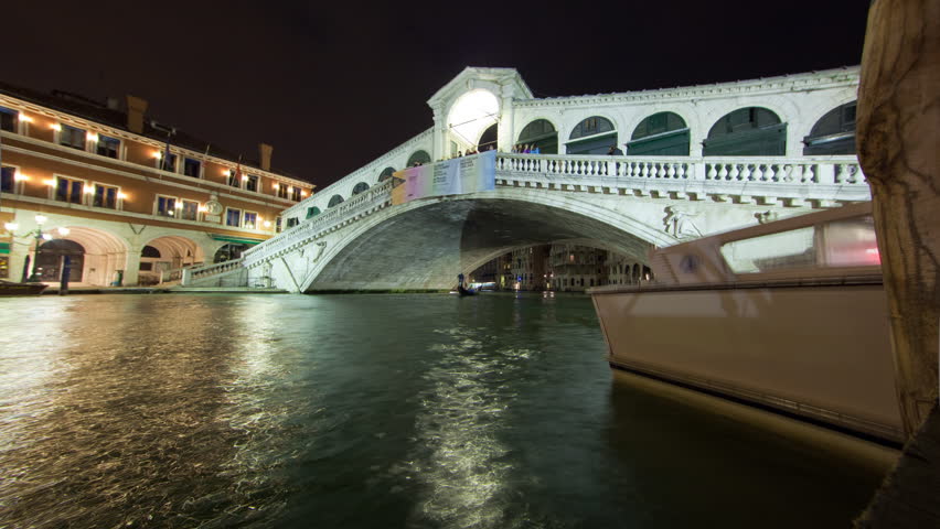 VENICE, ITALY - CIRCA MAY 2012: A Rialto bridge time-lapse from side of canal.