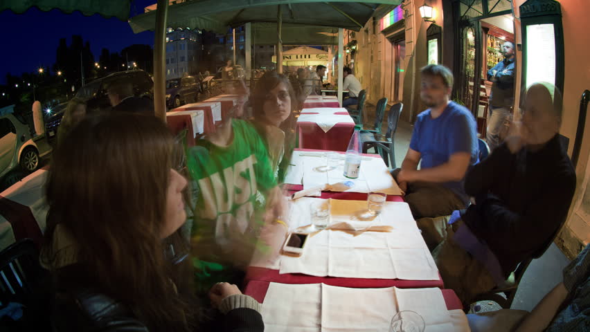 VENICE, ITALY - CIRCA MAY 2012: Time-lapse of tourist eating a meal.