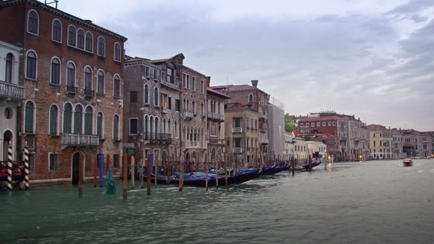VENICE, ITALY - MAY 2, 2012: Motor boats, gondolas, and buildings of the Grand