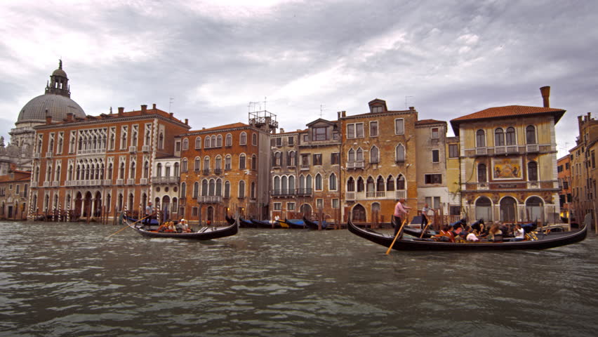 VENICE, ITALY - MAY 2, 2012: Gondolas and waterfront buildings of Venice