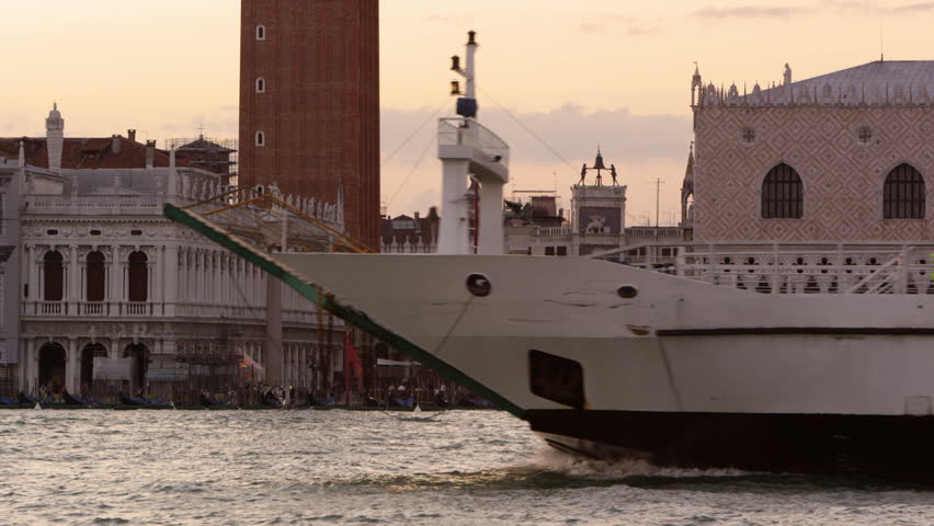 VENICE, ITALY - MAY 3, 2012: Static shot of a ferry going by Piazza San Marco in