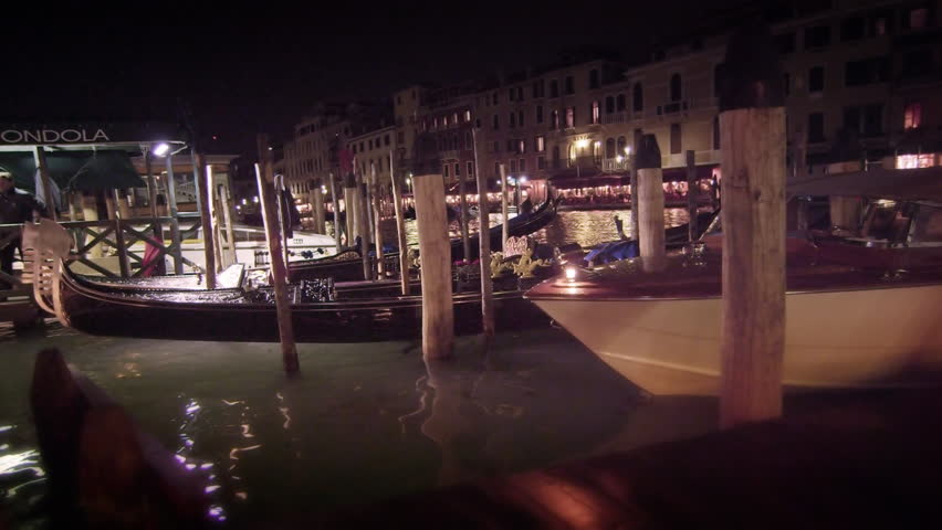VENICE, ITALY - MAY 2, 2012: Gondola docks along the Grand Canal