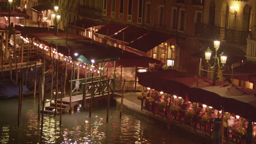 VENICE, ITALY - MAY 2, 2012: Dock and walkway with seating areas