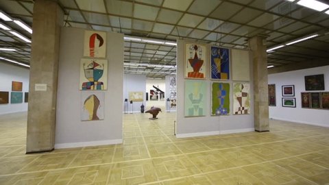 RUSSIA, MOSCOW - SEP 19, 2012: Art gallery with beautiful paintings and figurines on the walls at Central House of Artists