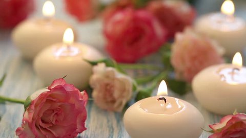 Pink roses and candles for spa