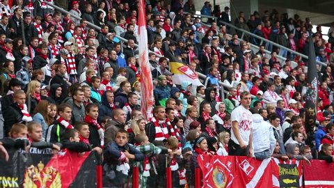 MOSCOW, RUSSIA - SEP 9, 2012: Fans shout at football match Spartak Moscow - Dynamo Kiev at Lokomotiv stadium.