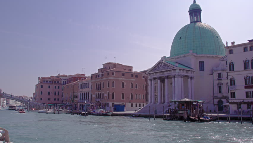 VENICE, ITALY - MAY 4, 2012: Slow motion footage of a tourist boat passing the