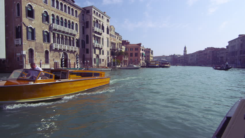 VENICE, ITALY - MAY 4, 2012: Tracking shot of waterside buildings on Grand Canal