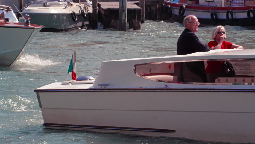 VENICE, ITALY - MAY 4, 2012: Slow motion shot of boats in venetian canal