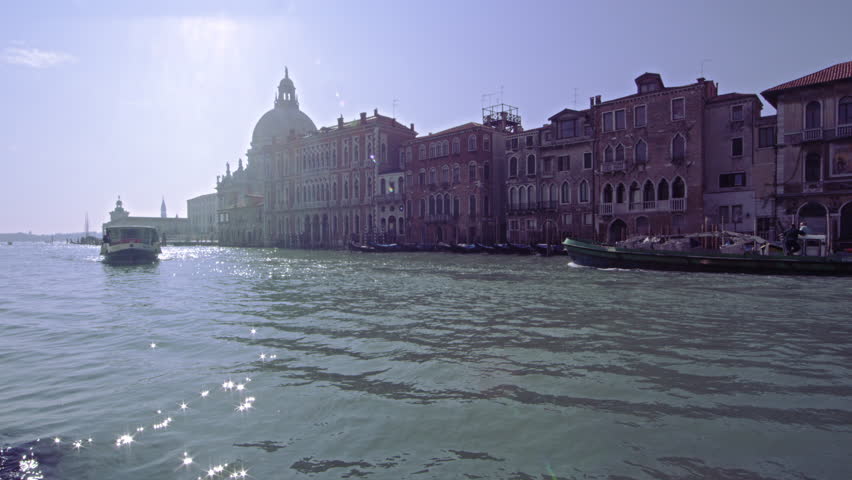 VENICE, ITALY - MAY 4, 2012: Boat approaching on canal in Venice.