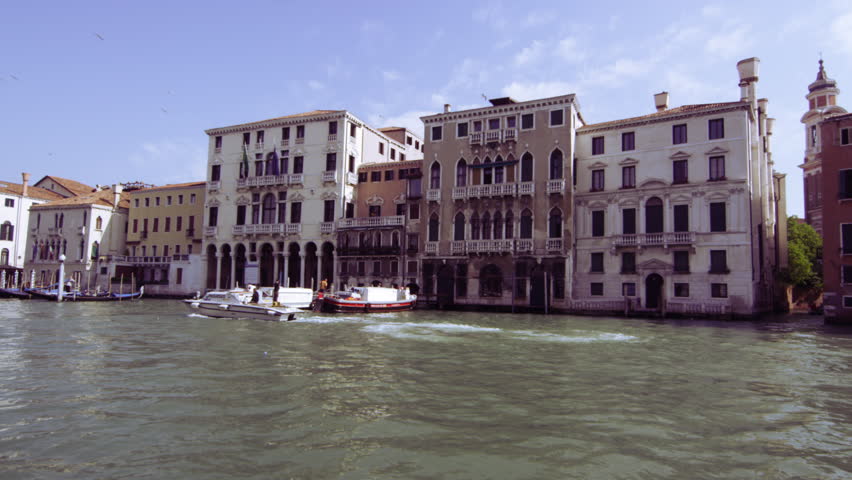 VENICE, ITALY - MAY 4, 2012: Slow motion shot of motor boats traveling on the