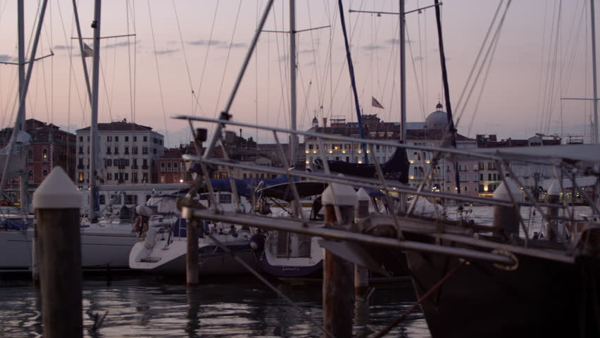 VENICE, ITALY - MAY 3, 2012: Panning shot of sailboats at the marina of San
