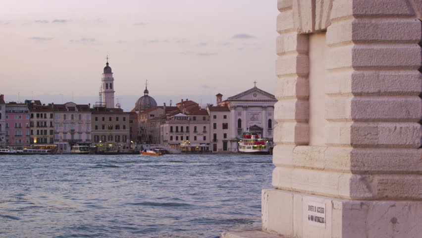 VENICE, ITALY - MAY 3, 2012: Panning shot of the wharf along the canal