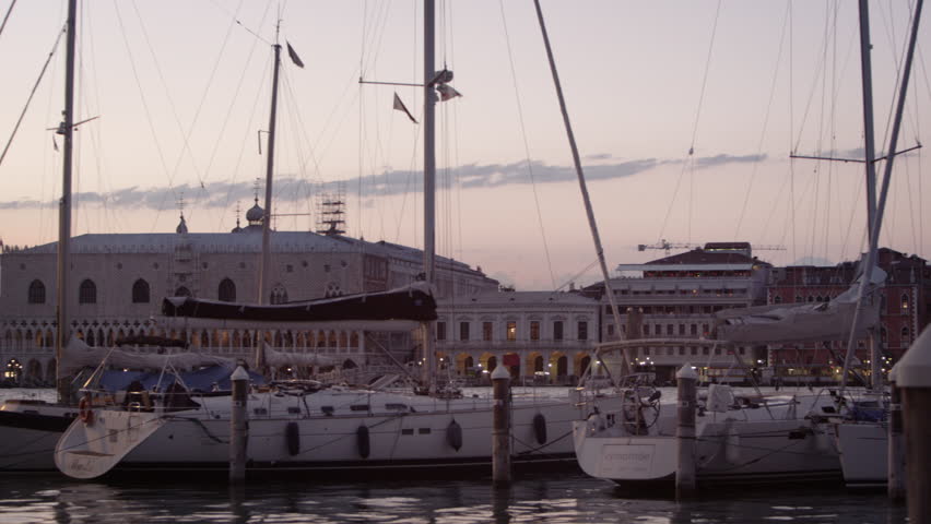 VENICE, ITALY - MAY 3, 2012: Panning shot of Piazza San Marco from the marina at