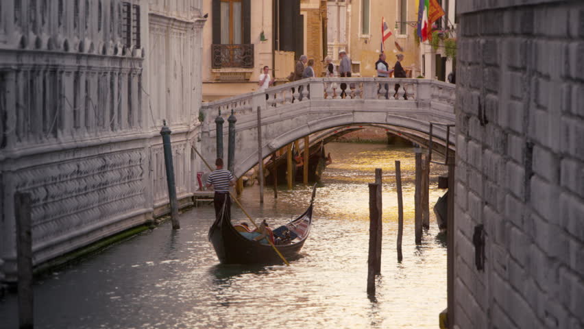 VENICE, ITALY - MAY 3, 2012: Gondola in the canal next to the Doge's Palace.