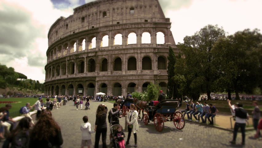 ROME, ITALY - MAY 6, 2012: Pedestrians in front of The Colosseum in Rome Italy