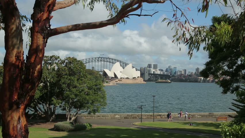SYDNEY, NSW/AUSTRALIA - FEBRUARY 02, 2014: Sydney Opera House and Harbour Bridge. The Opera House opened in October 1973 and was designed by Jorn Utzon.