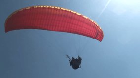 Paraglider in blue sky. Sport paraglide.