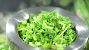 Portion of fresh cutted Chive (loopable HD video)