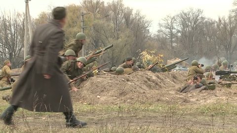 KIEV, UKRAINE - NOVEMBER 04, 2013 : 04.11.2013. Reconstruction of the hostilities of the Second world war in Kiev. The soldiers are forcing the Dnieper river near Kiev, and attack the enemy.