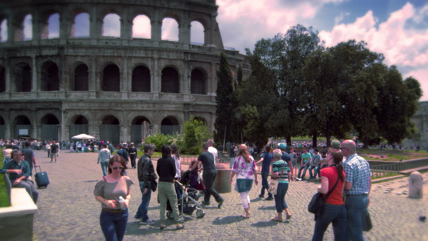 ROME, ITALY - MAY 6, 2012: People walking in front of The Colosseum in Rome
