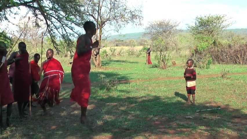 NGORONGORO, KIGALI, TANZANIA - CIRCA DEC, 2011: People of Maasai tribe during wedding ceremony jump and sing. Masai warriors jump for women standing against for wed | Shutterstock HD Video #5838668