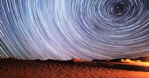 4K Stunning Star Trails Galaxy Cosmos Time-lapse over Death Valley Desert in California. Polaris North Star at center as earth rotates on axis. Beautiful in 4K. Featured in National Geographic. 