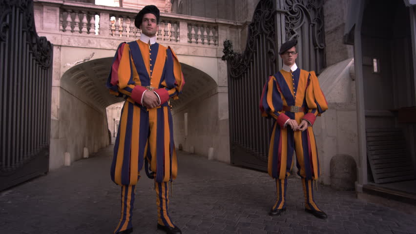 ROME, ITALY - MAY 8, 2012: The camera tilits up from two Swiss Guards.