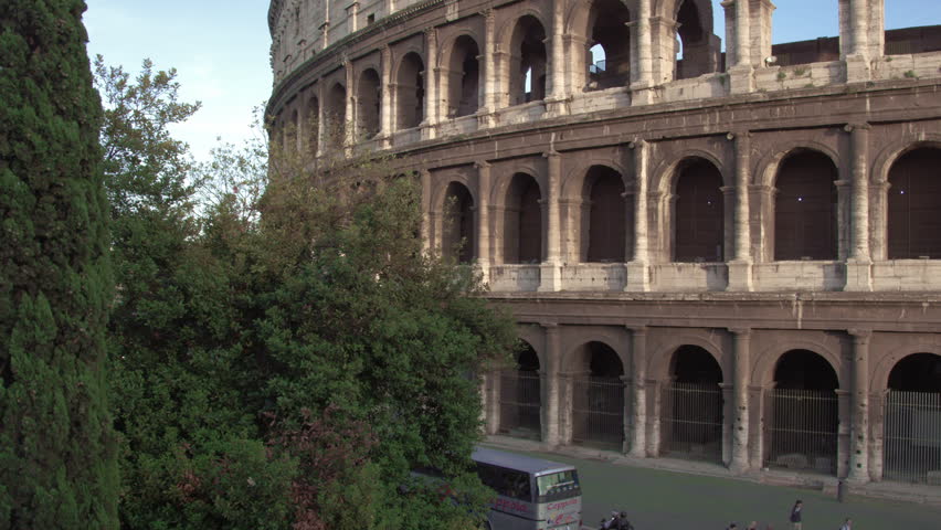 ROME, ITALY - MAY 6, 2012: Slow motion pan of Colosseum to Arch of Constantine