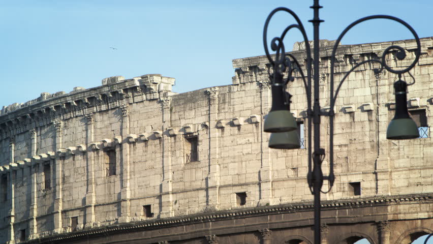 ROME, ITALY - MAY 6, 2012: Downward tilt shot from Colosseum to busy street