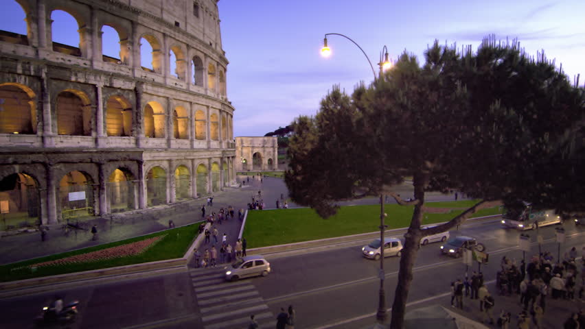 ROME, ITALY - MAY 6, 2012: Slow motion pan of vehicles on the street next to the