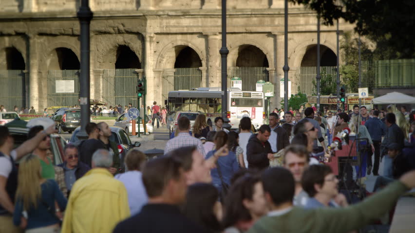 ROME, ITALY - MAY 6, 2012: Slow motion shot of tourists outside of Colosseum