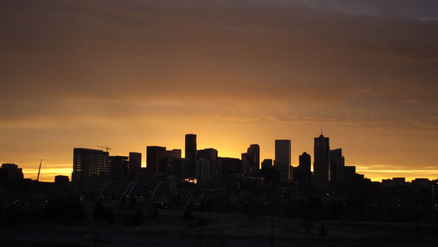Time lapse of a hazy sunrise over the Denver skyline.