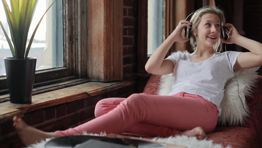 Happy Teen Wears Headphones, Listens To Records, And Dances