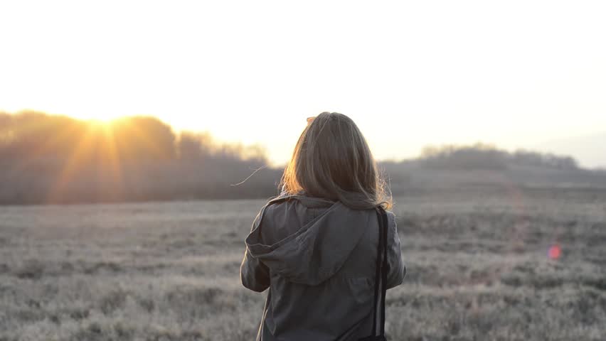 Young girl photograph/making movie with camera