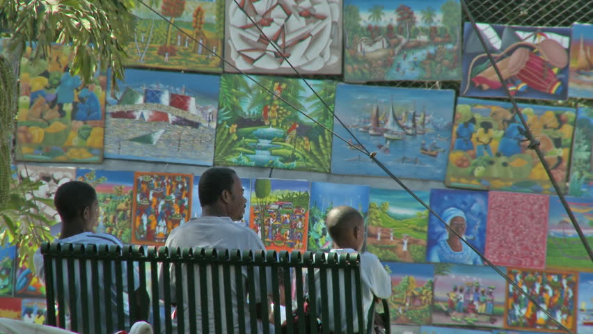 Port-au-Prince, Haiti - Jan 2009: Down town at a park in the Haitian capital. People relax, walking and talking.