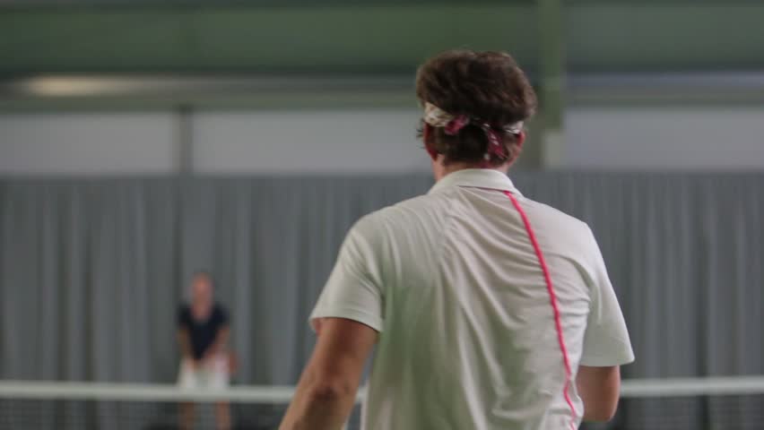 A man is playing tennis.