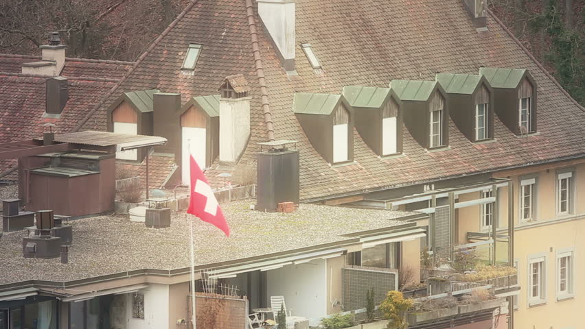 Swiss Flag over a roof in Bern