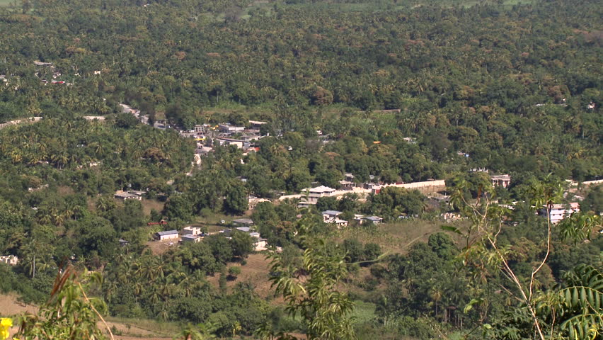 Port-au-Prince, Haiti - Jan 2009: Heat haze rises in front of a small town and roads through farmland in south Haiti.