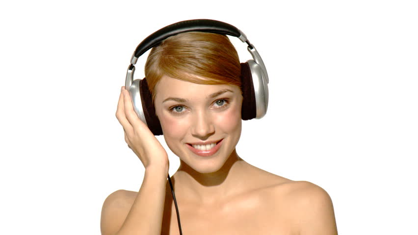 Portrait of beautiful and sexy woman singing in headphones 