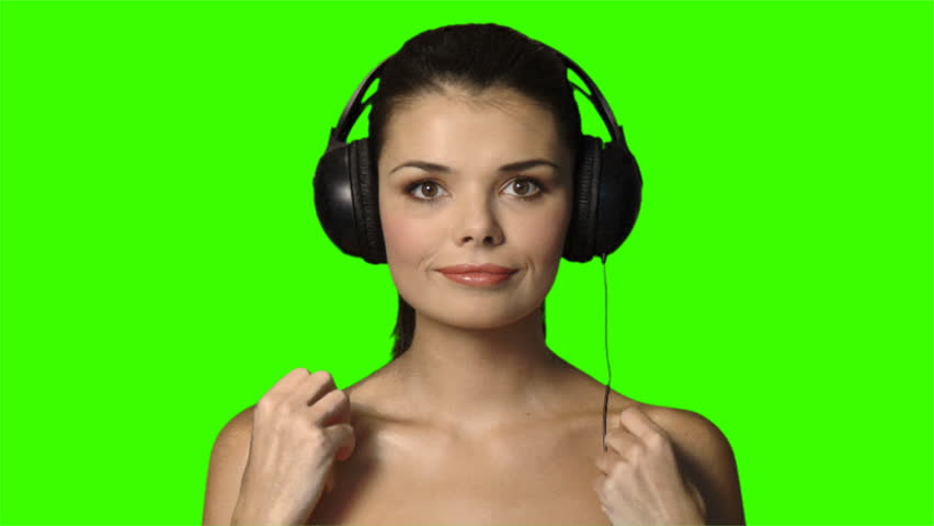 Portrait of beautiful and sexy woman listen to music in headphones 