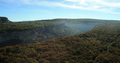 Aerial View: Chufut-Kale fortress. Mountain plateau of Burunchak, near Bakhchisaray. Kacha river canyon. Crimea. Autumn 2013.