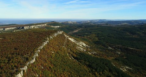 Aerial View: Chufut-Kale fortress. Mountain plateau of Burunchak, near Bakhchisaray. Kacha river canyon. Crimea. Autumn 2013.