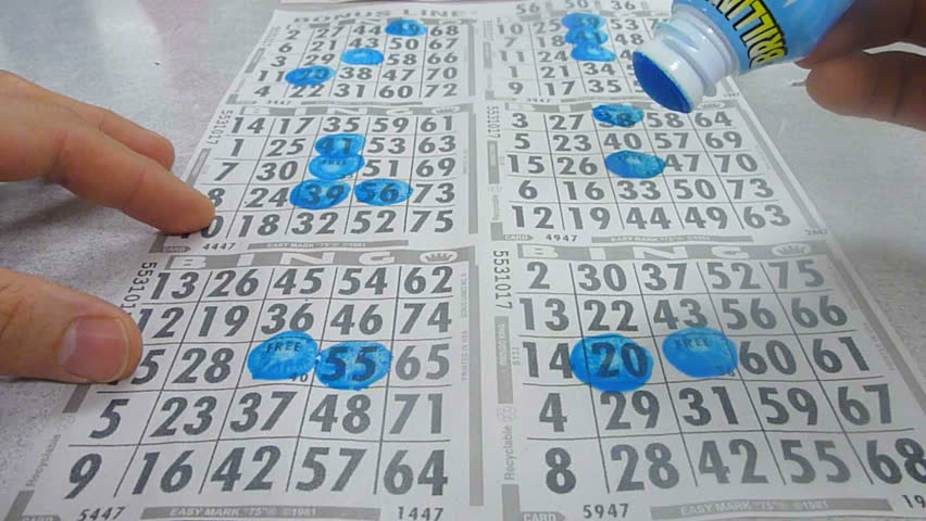 Time lapse of person stamping bingo cards. Royalty-Free Stock Footage #5863049
