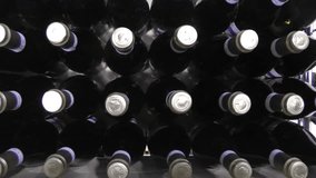 Bottles of Prosecco stored in winery, Italy, dolly camera movement.