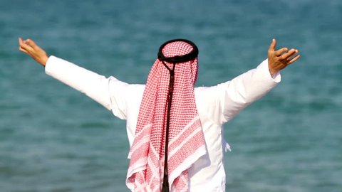 Arabian man,on the beach.Arab man walks along the sea