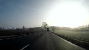 P.O.V. Video footage of driving on a german country road in the early morning