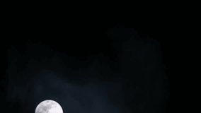 Full highly detailed moon with wispy clouds, timelapse