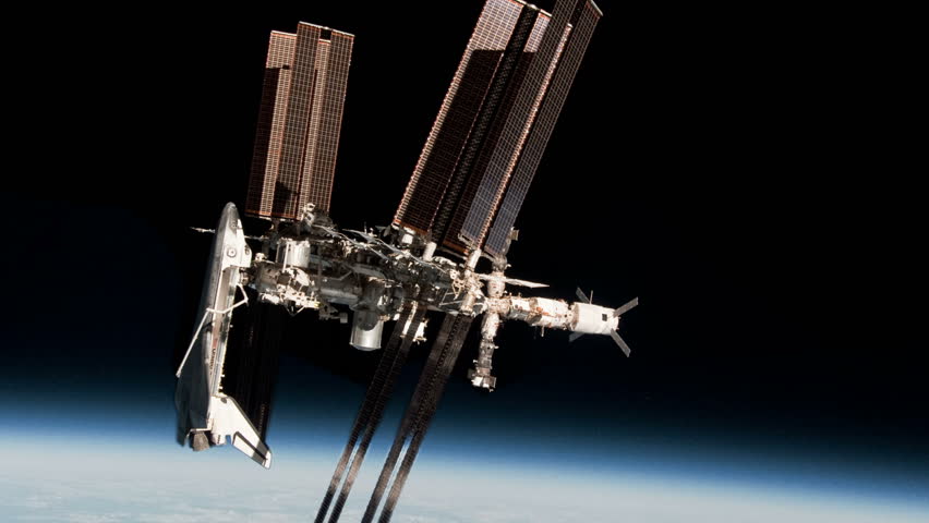 Space Station and Shuttle with Astronaut by Earth